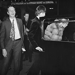 Brian Epstein, George Harrison and Pattie Harrison leave the Garrick Theatre, London