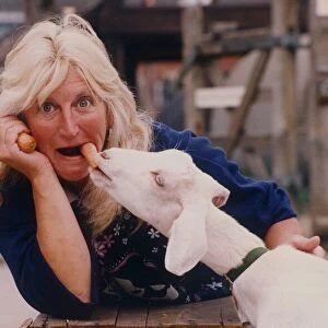 Bridgette the goat takes a carrot from Sandra Wilcox of Coventrys City Farm