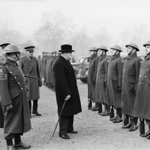 British Prime Minister Winston Churchill, accompanied by his wife Lady Churchill