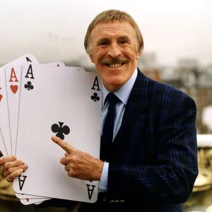 Bruce Forsyth TV Presenter Holding playing cards which are used on his hit tv show Play