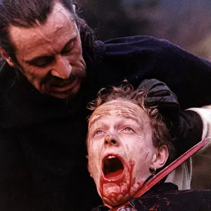 The Bruce Gladiator Wolf cutting mans throat with sword scene from film The Bruce
