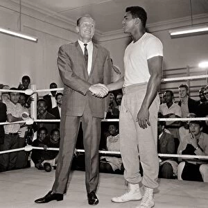 Cassius Clay August 1966 In training, shaking hands with Henry Cooper