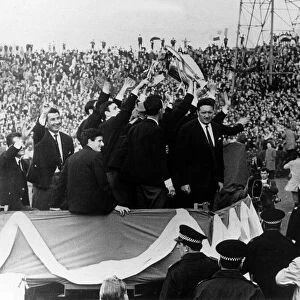 The Celtic team led by their manager Jock Stein, parading the European Cup trophy at