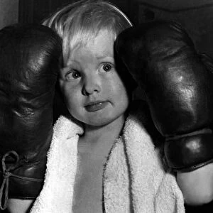 Children - Boys Boxing Young boy wearing boxing gloves, towel around his neck