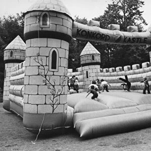 Children enjoy a bouncy castle