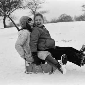 Children sledging on a milk crate in Greenwich Park, London, 27th December 1970