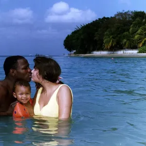 Chris Eubank Boxer in the sea in barbados with his wife Karron and son Chistopher