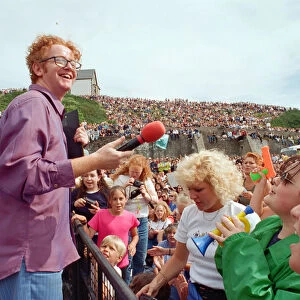 Chris Evans, DJ on Radio One, presents the Radio One Roadshow from Tenby in South Wales