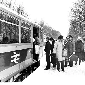 Christmas shoppers get on one of the new British Rail Pacer trains on 21st December 1985