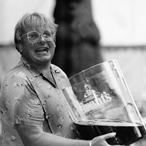 Christopher Biggins with giant glass of Grants Whiskey 1989