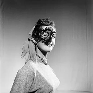 Clothing: Woman wearing party mask. 1955 B89-002