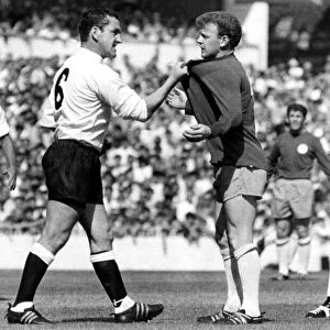 Dave Mackay of Tottenham Hotspurs confronts Billy Bremner of Leeds during the First