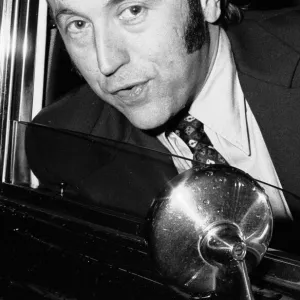 David Frost driving away from his London Home in his Bentley after splitting up with his