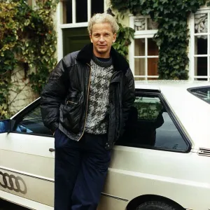 David Gower ex England Player standing beside white Audi Quatro dbase