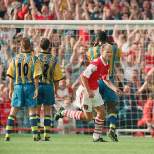 Dennis Bergkamp celebrates his second goal for his new club Arsenal