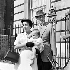 Elizabeth Taylor and Michael Wilding with their baby, who stays in London while Liz