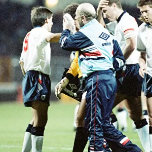 England v Brazil 28th March 1990, Wembley. Peter Shilton is led from the field by physio