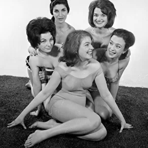 Fashion shoot for models wearing swimsuits. They are left to right: Delia Smith
