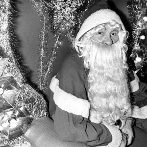 Father Christmas sitting in his chair waiting for his next visitor