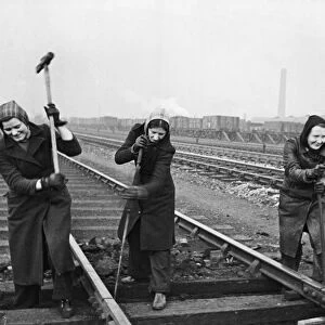 Some of the first women gangers with LNER, busy at work in Sheffield on one of the train