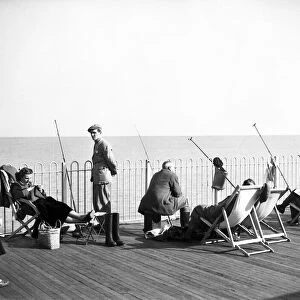Fishing from Hastings Pier, East Sussex. 6th October 1952