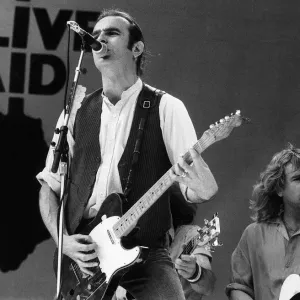 Francis Rossi lead singer with Pop Group Status Quo singing on stage at Live Aid concert