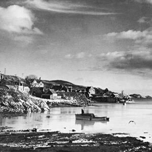 General view of Tarbert Harbour, on the Isle of Harris, Scotland. Circa 1930