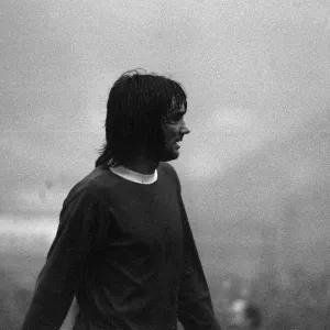 George Best appears out of the mist in the Huddersfield v Manchester United game on a