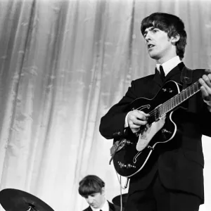 George Harrison of the Beatles seen here on stage November 1964