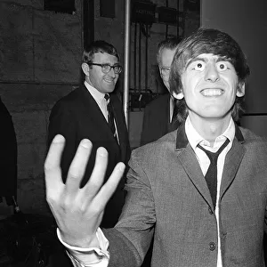 George Harrison with glass eyes when the Beatles details were being taken for their