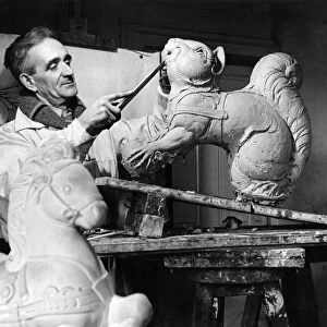 George Morwood the sculptor working on a model. March 1947 P004768
