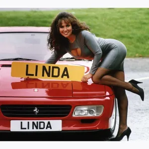 Glamour Model Linda Lusardi leans on a 512 TR Ferrari worth £