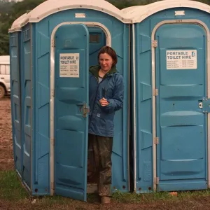 Glastonbury Festival 1997 with Mirror reporter Lucy Rock coming out of a portaloo