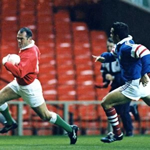 Ieuan Evans on a break for Wales against France. 1998