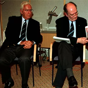 Jack McGinn Celtic football director sitting in chair showing Dazily Record to Bill
