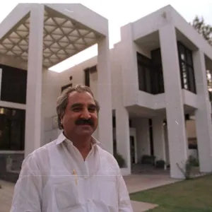 Jehangir Monnoo multi millionaire standing outside his mansion in Lahore where Princess