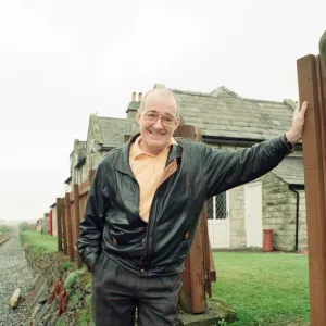 Jim Bowen by the railway which passes by his house in Arkholme, Lancashire