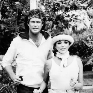 Joan Collins the actress with David Hasselhoff the actor jogging together. July 1984