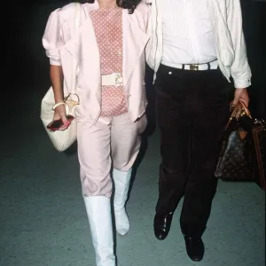 Joan Collins and Peter Holm at London Airport on the way to Nice September