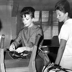 Joan Collins and sister Jackie Collins at London Airport - September 1960