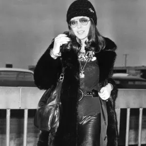 Joan Collins wearing fur coat at London Airport - December 1971