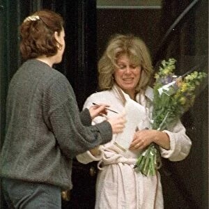 Joanna Lumley at home receiving flowers from the Daily Mirror