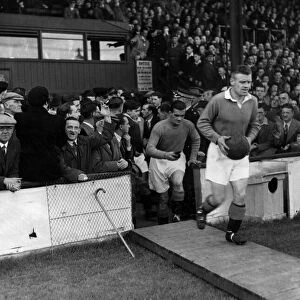 Jock Shaw leads out the Rangers team, followed by Dawson before the Clyde v Rangers
