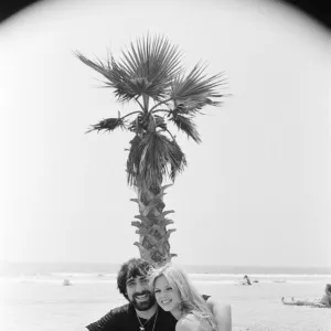 Keith Moon, drummer of The Who rock group with model Annette Lax in the resort of Malibu