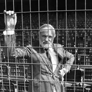 Ken Bates Chairman of Chelsea Football Club Seen standing Behind Electric Fence at