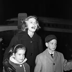 Lauren Bacall at London Airport with her two children, Stephen (aged 10