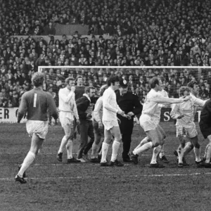 Leeds players surround referee Ray Tinkler after he awarded a controversial goal