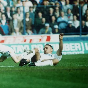 Leeds United footballer Vinnie Jones tackling the match mascot. 23rd October 1989