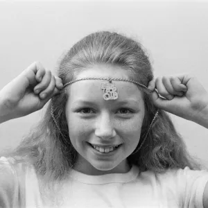 Lena Zavaroni wears a Daily Mirror Pop Club T-Shirt and a Daily Mirror Pop Club Pendant