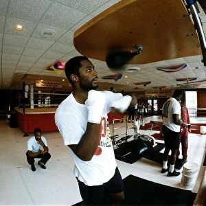 Lennox Lewis Boxing Heavyweight boxer training in the gym punching punch ball